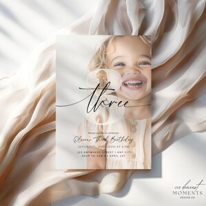 May include: A birthday invitation with a photo of a young girl smiling. The invitation is for a third birthday party and includes the text "Please join us to celebrate Olivia's Third Birthday, Saturday, June 26th at 4 PM, 123 Anywhere Street | Any City, RSVP to Sam by April 1st".