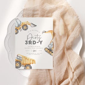 May include: A white invitation card with a watercolour illustration of yellow construction vehicles. The text on the card reads "It's Oliver's Dirty 3rd-Y. Save the date for some fun for Oliver's third birthday. Sept | 20 | 2PM. 123 Anywhere Rd, Any City. RSVP to Samantha."