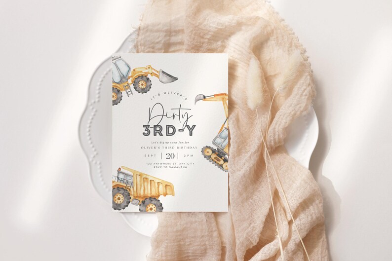 May include: A white invitation card with a watercolour illustration of yellow construction vehicles. The text on the card reads "It's Oliver's Dirty 3rd-Y. Save the date for some fun for Oliver's third birthday. Sept | 20 | 2PM. 123 Anywhere Rd, Any City. RSVP to Samantha."