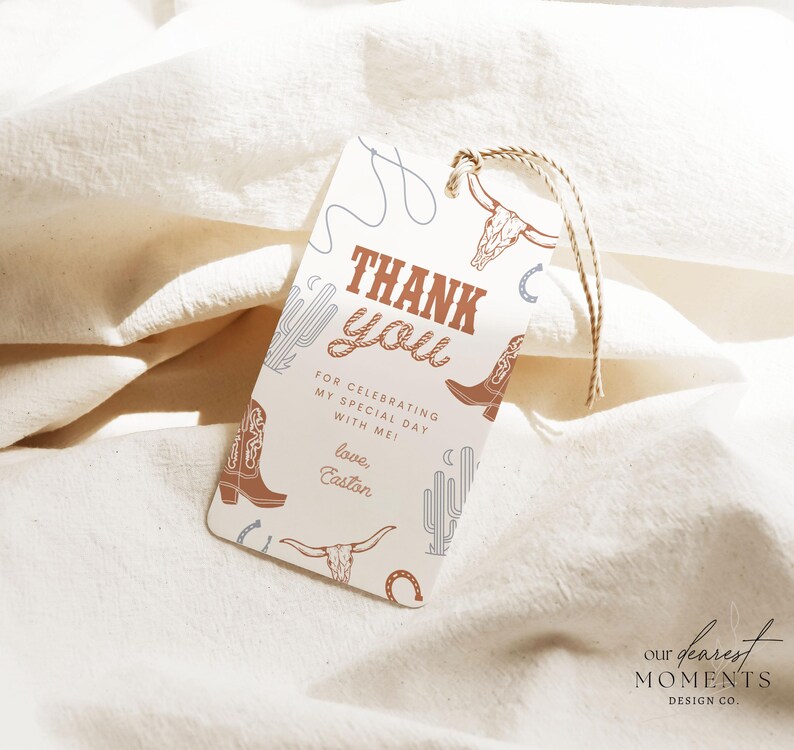 May include: A white thank you tag with brown and blue illustrations of cowboy boots, cacti, and a lasso. The text reads "Thank you" in brown letters and "For celebrating my special day with me! Love, Easton".