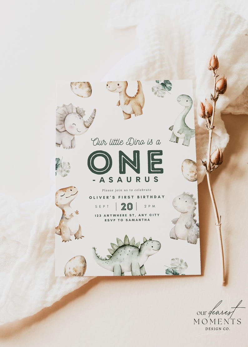 May include: A dinosaur-themed first birthday party invitation with a green and white dinosaur illustration and the text "Our little Dino is a ONE -ASAURUS". The invitation includes the date, time, and location of the party. The text "Please join us to celebrate OLIVER'S FIRST BIRTHDAY SEPT 20 2PM 123 ANYWHERE ST, ANY CITY RSVP TO SAMANTHA" is printed on the invitation. The invitation also includes the text "our dearest MOMENTS DESIGN CO."