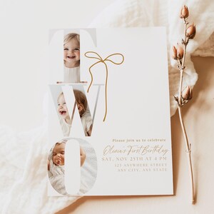 May include: A white invitation card with the word "TWO" featuring three baby photos. The card includes the text "Olivia's First Birthday" and event details in gold script, with a gold bow graphic.