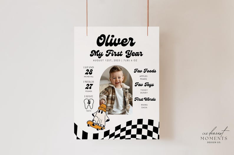 May include: A black and white checkered background with a photo of a baby boy in a brown and white sweater. The text "Oliver My First Year" is at the top of the poster. The poster also includes the baby's stats, such as height, weight, and number of teeth. The text "Fav Foods", "Fav Toys", and "First Words" are listed with examples of each.