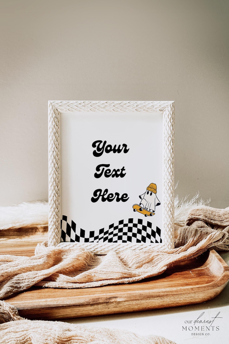 May include: White picture frame with a black and white checkered pattern and a ghost on a skateboard. The text "Your Text Here" is written in black cursive font.