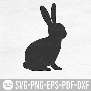 Może przedstawiać: Czarna sylwetka siedzącego królika z uniesionymi uszami. Królik patrzy w prawo.