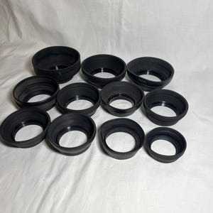 Vintage rubber collapsible sun hoods for camera lenses. Variable sizes