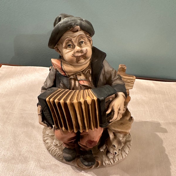 A Price Import hobo Man Accordian with Dog Park Bench Figurine