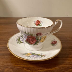 Vintage Royal Heritage Bone China Roses pattern Teacup and Saucer.