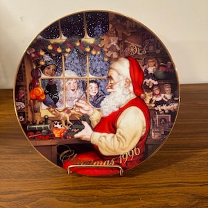 Avon 1996 Christmas “Santa Loving Touch” Plate.