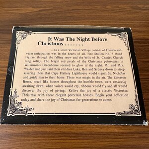 May include: A vintage box for a set of porcelain houses depicting a Victorian Christmas scene. The box features a black and white illustration of a church and a quote from the poem 'Twas the Night Before Christmas'.