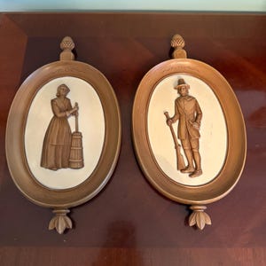 Vintage Set of 2 Syroco Wall Hanging Plaques Colonial Pilgrims Woman Butter and  Churn Man Musket