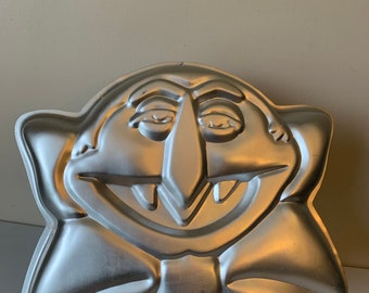 Get Spooktacular with the 1977 Wilton Count Dracula Cake Pan 502-7431: A Sesame Muppet Vintage Baking Tin that Delivers Fang-tastic Treats