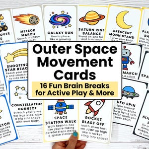 May include: A set of colorful Outer Space Movement Cards with illustrations and instructions for active play. The cards feature space-themed activities like "Moon Rover Ride" and "Alien Wiggle Dance". The cards are held by a hand.