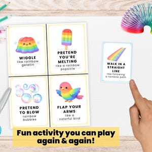 May include: Four illustrated activity cards with instructions, featuring a rainbow jelly, ice lolly, bubbles, and bird. Text reads "Fun activity you can play again & again!" A rainbow slinky and scissors are also visible.
