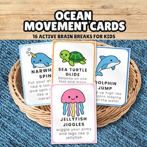 May include: A set of Ocean Movement Cards featuring 16 active brain breaks for kids. The cards display colorful illustrations of a narwhal, sea turtle, dolphin, and jellyfish with text instructions for physical movements, all contained in a woven basket.