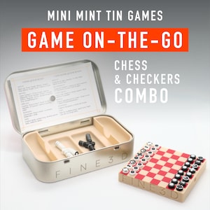 May include: A silver metal tin with a red and white checkerboard game and chess pieces inside. The tin is open and the game board is visible. The tin has the words "FINE 3D" printed on the side. The text on the tin reads "MINI MINT TIN GAMES GAME ON-THE-GO CHESS & CHECKERS COMBO".