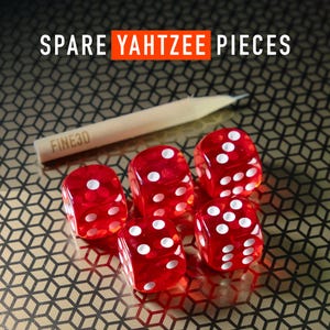 May include: Five red dice with white dots, labeled "Spare Yahtzee Pieces" on a black and gold patterned surface.