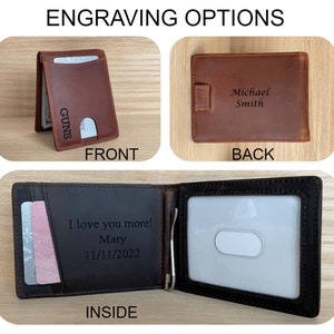 May include: A brown leather wallet with a money clip. The front of the wallet has the word "GUNS" engraved on it. The back of the wallet has the name "Michael Smith" engraved on it. The inside of the wallet has a slot for cards and a message engraved that says "I love you more! Mary 11/11/2022".