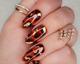 Druk op de nagels TORTIS