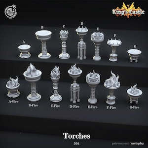 May include: A set of nine white, detailed, miniature torch designs with flames. The torches are labeled A-Fire through G-Fire. The text "Torches 504" and "patreon.com/castnplay" are at the bottom of the image.