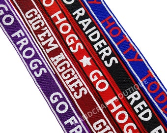 May include: Five beaded straps with different team names and colours. The straps are red, black, blue, purple, and maroon. The text on the straps reads "Go Hogs Go", "Red Raiders", "Gig'em Aggies", "Go Frogs Go", and "Hotty Toddy".