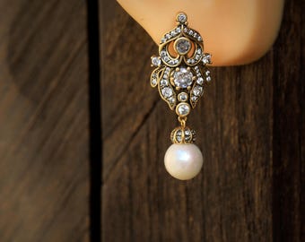Stunning clip-on stud earrings, non-pierced, gold-plated and silver-plated, floral Art Nouveau design with a genuine white cultured pearl and cubic zirconia setting, circa 1900s