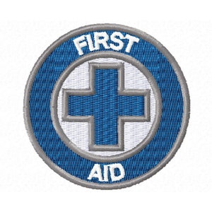 May include: An embroidered patch with a white cross in the centre and the words "FIRST AID" around the outside, in blue and white.
