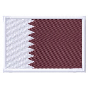 May include: A white patch with a maroon rectangle on the right side. The maroon rectangle has a jagged white shape on the left side. The patch is surrounded by a white border.