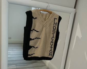 Hand knitted vest with Greek text with open back
