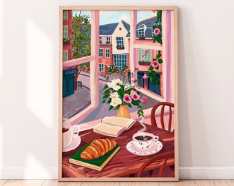 May include: A framed illustration of a window view with a cafe, buildings, and flowers. A table with a croissant, a cup of coffee, and an open book is in the foreground.