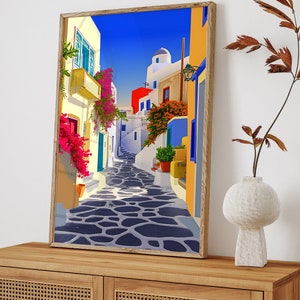 May include: A colorful painting of a narrow street in a Mediterranean village. The street is lined with white buildings with blue accents and vibrant pink flowers. The cobblestone street is shaded by a blue sky.