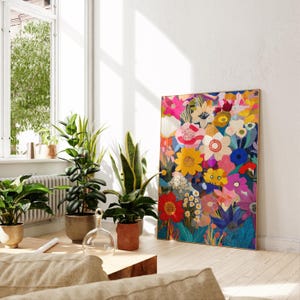 May include: A colorful floral print canvas wall art featuring a variety of flowers in shades of pink, yellow, red, blue, and green. The flowers are arranged in a dense, layered pattern, creating a vibrant and eye-catching design.