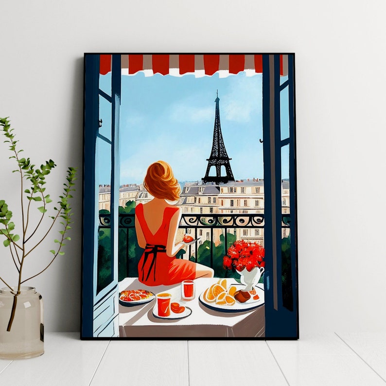 Pode incluir: Uma mulher de vestido vermelho senta-se em uma varanda com vista para a Torre Eiffel em Paris, Fran&ccedil;a. Ela est&aacute; desfrutando de um caf&eacute; da manh&atilde; com frutas, doces e suco. A varanda tem uma grade de ferro forjado e vista para a cidade.