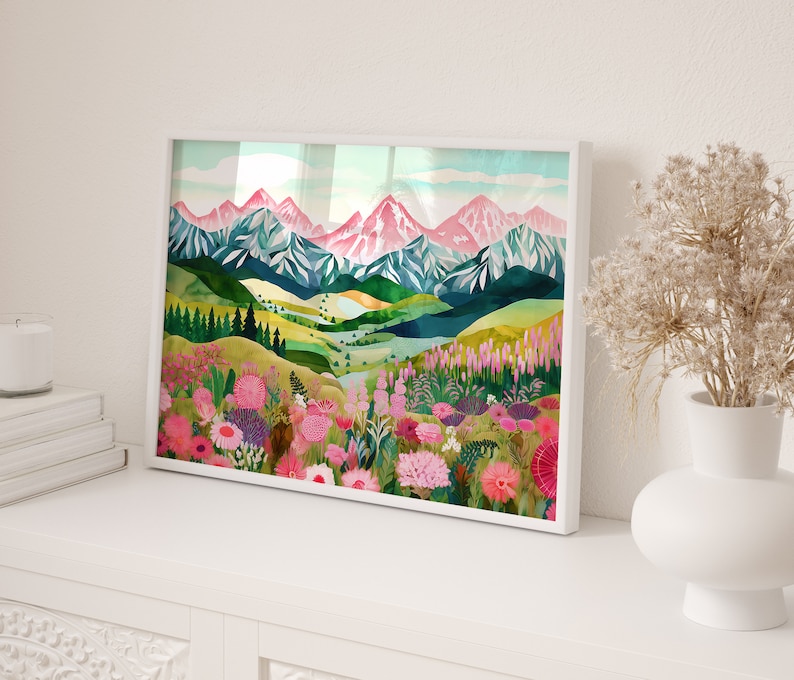 May include: A framed watercolor painting of a mountain landscape with pink and green hues. The mountains are covered in snow and the foreground features a field of pink and purple flowers.