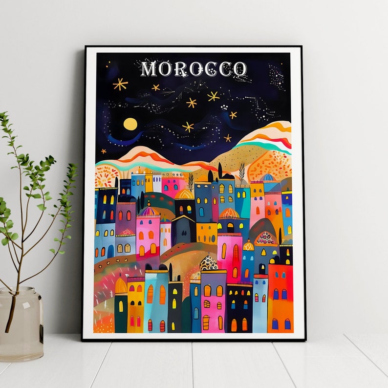 May include: A colorful illustration of a cityscape with the word "MOROCCO" at the top. The buildings are a mix of pink, blue, yellow, and orange, and there are stars in the night sky.