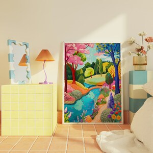 May include: A colorful framed landscape painting depicts a vibrant park scene with a river, bridge, and trees. A yellow tiled cube holds a lamp and a decorative mirror. The room has a warm, inviting atmosphere.