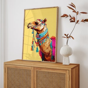 May include: A colorful illustration of a camel wearing a beaded necklace and a decorative headpiece against a yellow background.