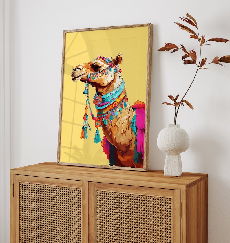 May include: A colorful illustration of a camel wearing a beaded necklace and a decorative headpiece against a yellow background.