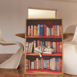 May include: A painting of a cat sleeping on a bookshelf filled with colorful books. The cat is brown and white and is lying on its side with its head resting on the books. The bookshelf is red and has three shelves. The books are all different sizes and colors.