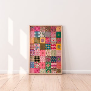 May include: A framed print of a colorful patchwork quilt design with various patterns and colors, including pink, green, blue, and yellow.
