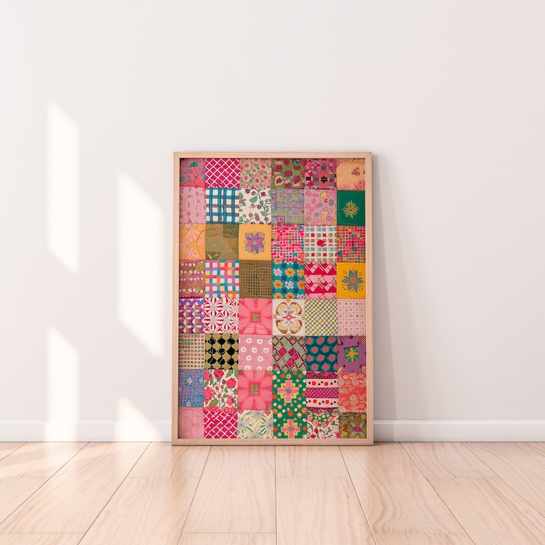 May include: A framed print of a colorful patchwork quilt design with various patterns and colors, including pink, green, blue, and yellow.