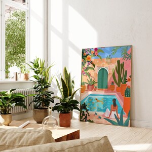 May include: A colorful illustration of a courtyard with a swimming pool, a woman relaxing in the pool, and a dog swimming. The courtyard is surrounded by lush greenery and flowers. The illustration is framed in a gold frame.