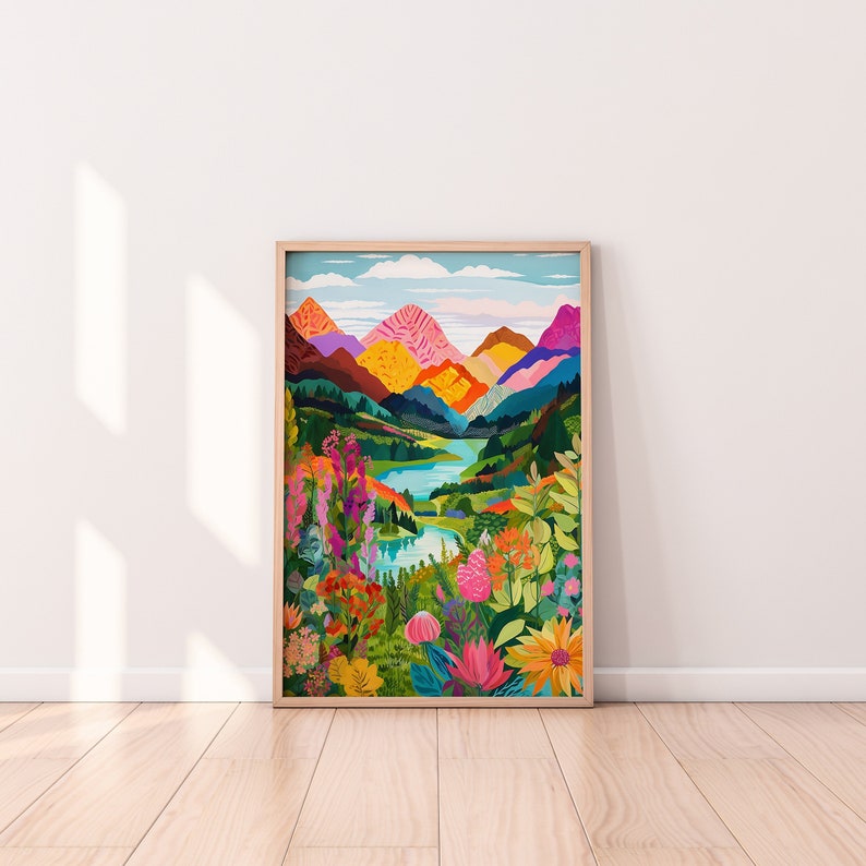 Puede incluir: Una impresi&oacute;n enmarcada de un paisaje colorido con monta&ntilde;as, un lago y flores. Las monta&ntilde;as son una mezcla de rosa, amarillo, naranja y verde. El lago es azul y est&aacute; rodeado de &aacute;rboles verdes y flores. Las flores son una mezcla de rosa, rojo, amarillo y morado.