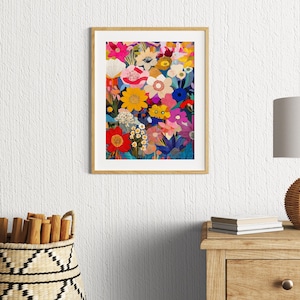 May include: A framed print of a colorful floral illustration. The flowers are in shades of pink, red, yellow, blue, and green. The background is a dark blue.