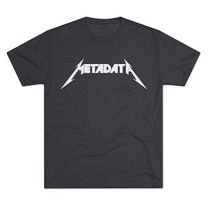 May include: A dark heather grey t-shirt with a white graphic of the word "METADATA" in a stylized metal band font.