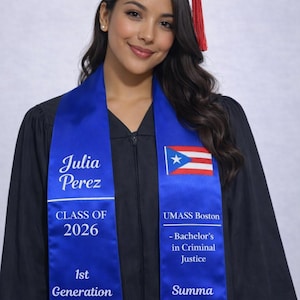 May include: A royal blue graduation stole worn over a black graduation gown. The left side features the name Julia Perez, Class of 2026, and 1st Generation. The right side displays the Puerto Rican flag, UMASS Boston, Bachelor's in Criminal Justice, and Summa Cum Laude.