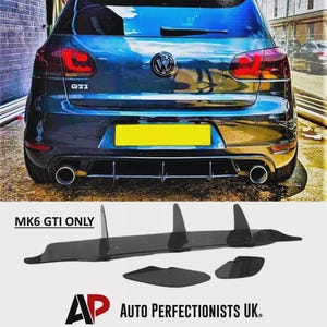 May include: A blue Volkswagen GTI car with a black rear diffuser kit. The kit includes a central panel and side fins. The text "MK6 GTI ONLY" and "AP AUTO PERFECTIONISTS UK" are visible.
