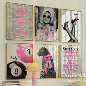 May include: A collection of framed wall art with gold frames. The art includes a pink lip print, a woman in sunglasses, legs in heels, a pool ball, a leopard with a pink bow, and text that reads "Guest Check What If It All Works Out?"