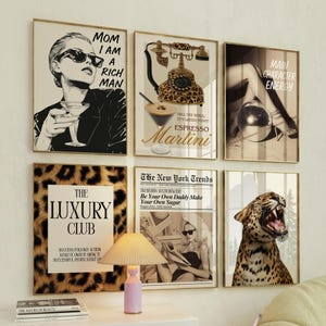 May include: A set of framed art prints with gold frames. The prints depict a range of images, including a woman in sunglasses, a leopard print telephone, a martini, a disco ball, a leopard, and text that reads "MOM I AM A RICH MAN" and "THE LUXURY CLUB".
