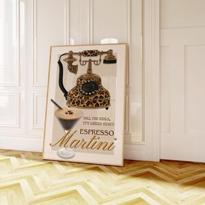 May include: A framed print featuring a vintage telephone with a leopard print design. The print also includes an espresso martini illustration and the words "Call the girls, it's ladies night! Espresso Martini."
